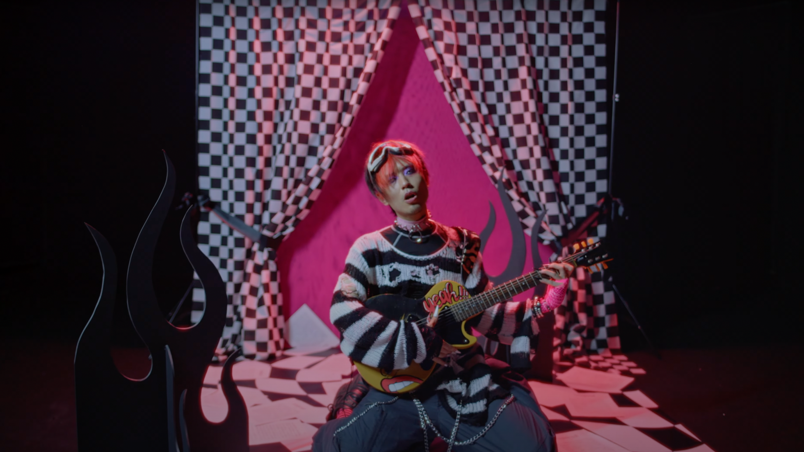 Still from the music video DM by Putochinomaricón