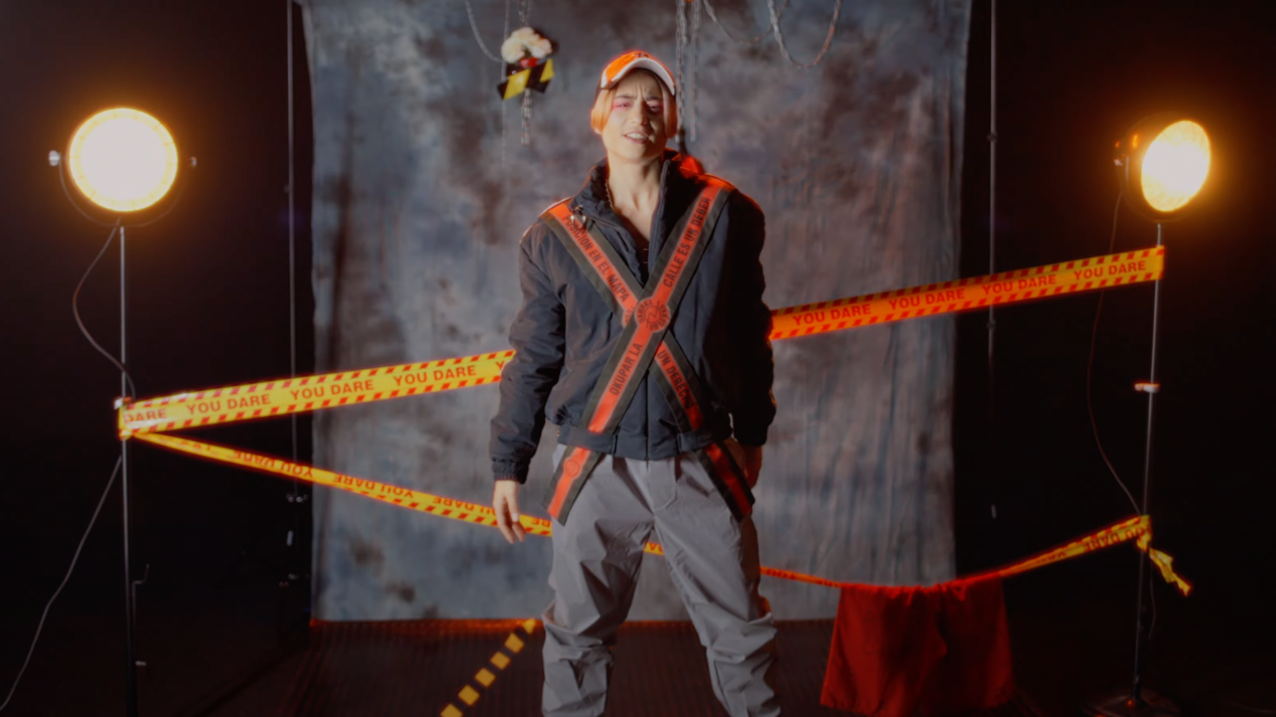 Still from the music video DM by Putochinomaricón